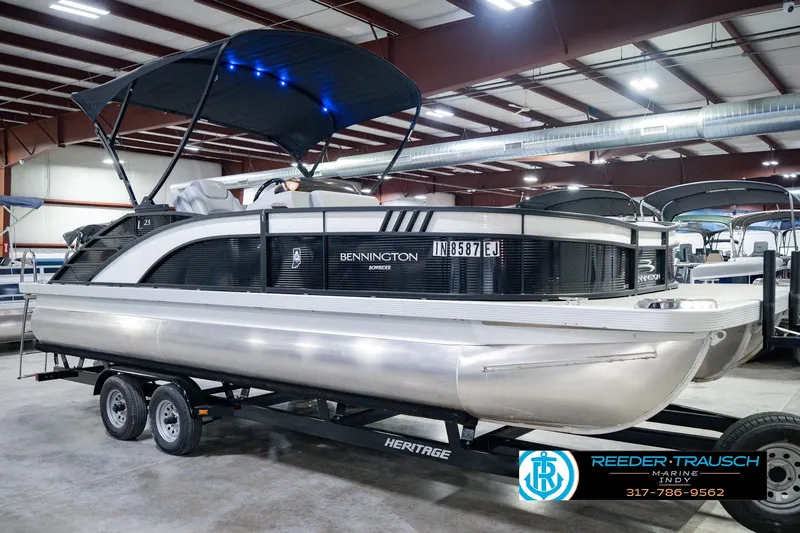 Slide: The Image of 2022 Bennington 23 LTSB pontoon boat on trailer in indoor showroom. - 5