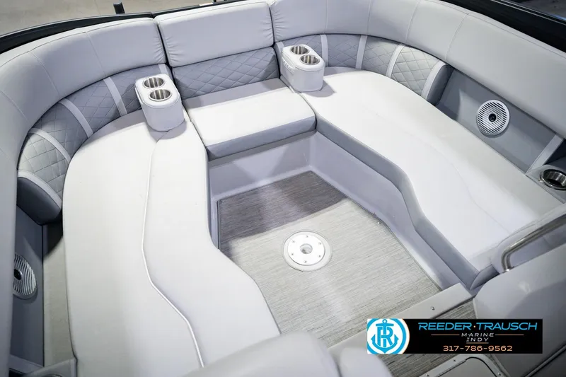Slide: The Image of Luxurious seating area of 2022 Bennington 23 LTSB pontoon boat with cup holders. - 54