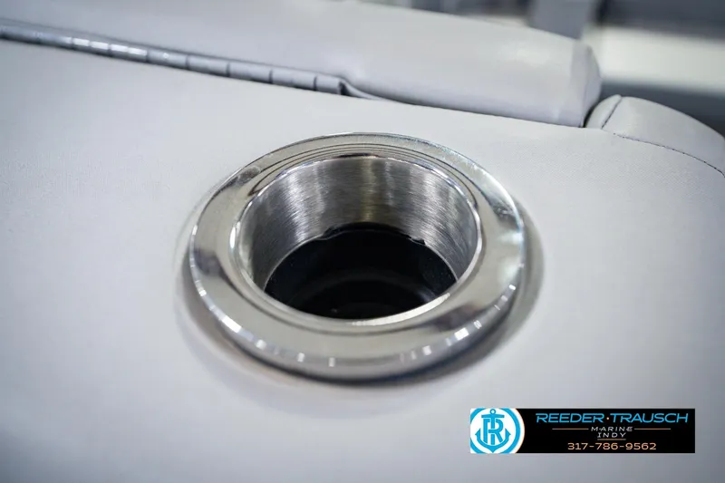 Slide: The Image of Close-up of a 2022 Bennington 23 LTSB boat cup holder with sleek metal finish. - 56