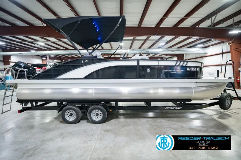 Slide: The Image of 2022 Bennington 23 LTSB pontoon boat on trailer in indoor showroom. - 6