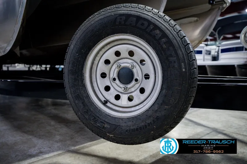 Slide: The Image of Trailer wheel of a 2022 Bennington 23 LTSB boat at Reeder Trausch Marine. - 69