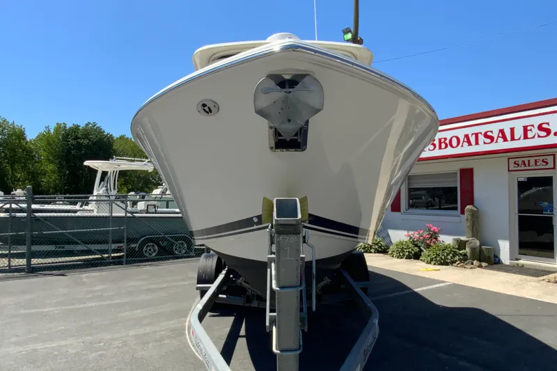 Slide: The Image of 2021 Pursuit DC 266 Dual Console boat on trailer at dealership. - 4