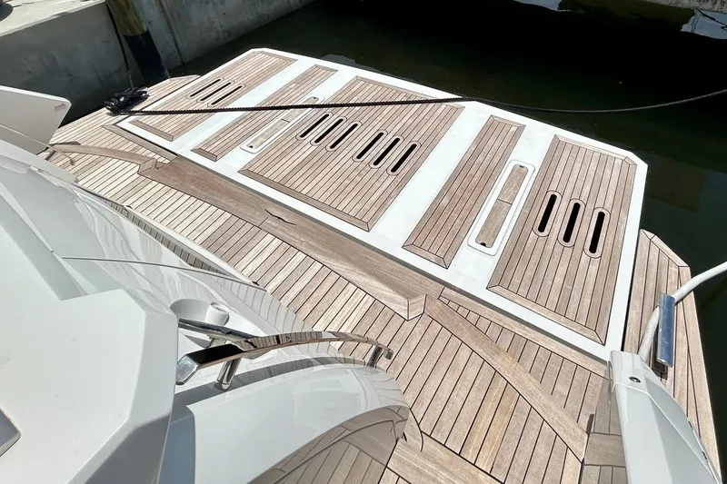 Slide: The Image of Luxury yacht Aicon Vivere 66, 2024 model, featuring elegant teak decking. - 10