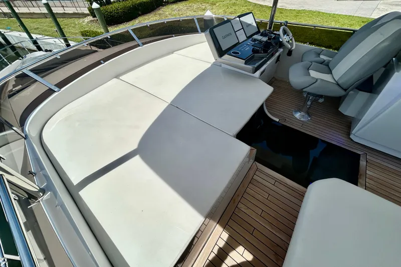 Slide: The Image of Flybridge of 2024 Aicon Vivere 66 yacht with helm and seating area. - 101