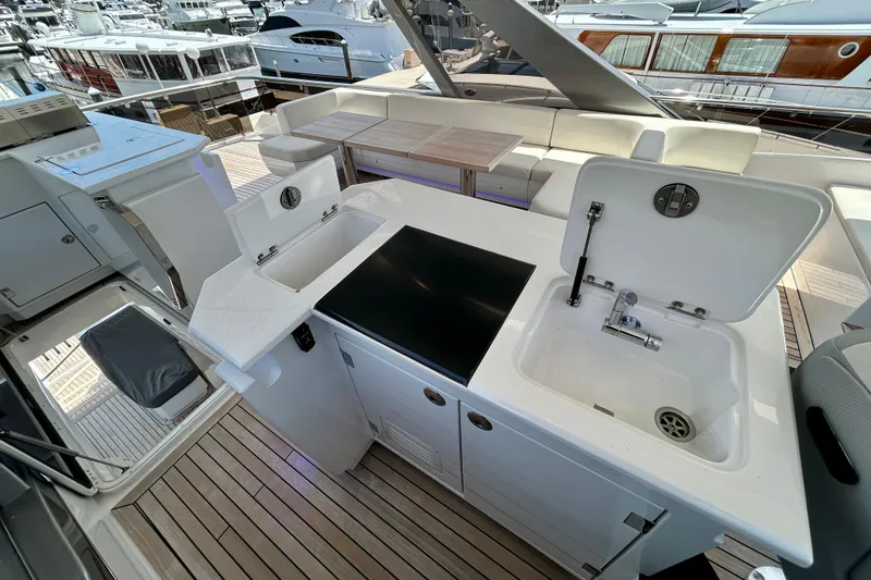 Slide: The Image of Luxurious 2024 Aicon Vivere 66 yacht deck with modern kitchen amenities and seating area. - 103