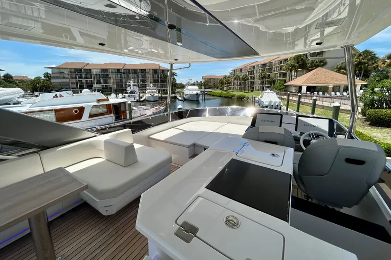 Slide: The Image of Luxurious 2024 Aicon Vivere 66 yacht interior with modern seating and navigation equipment. - 105