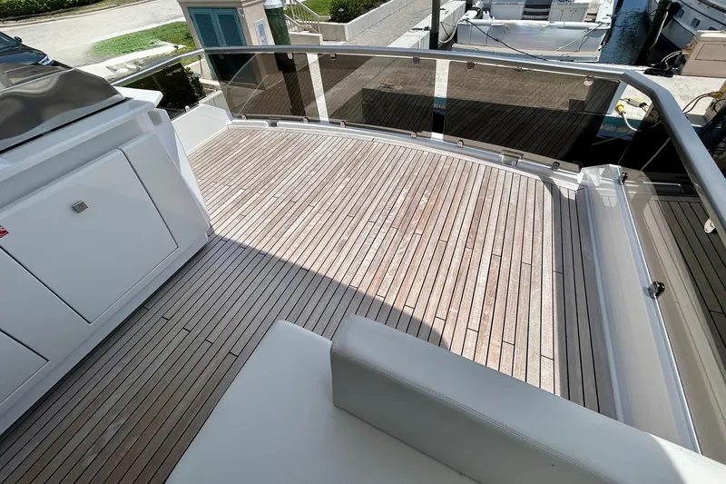 Slide: The Image of Aicon Vivere 66 yacht deck, 2024 model, featuring sleek wooden flooring and modern design. - 106
