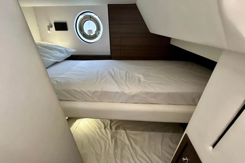 Slide: The Image of Crew cabin of 2024 Aicon Vivere 66 yacht with bunk beds and porthole. - 115