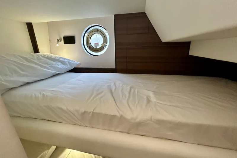Slide: The Image of Crew cabin bed in 2024 Aicon Vivere 66 yacht with porthole view. - 116