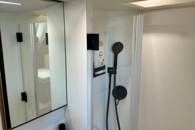 Slide: The Image of Crew full head of 2024 Aicon Vivere 66 yacht with sleek shower design. - 117