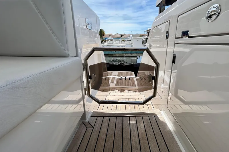 Slide: The Image of 2024 Aicon Vivere 66 yacht deck with sleek design and luxurious seating. - 12