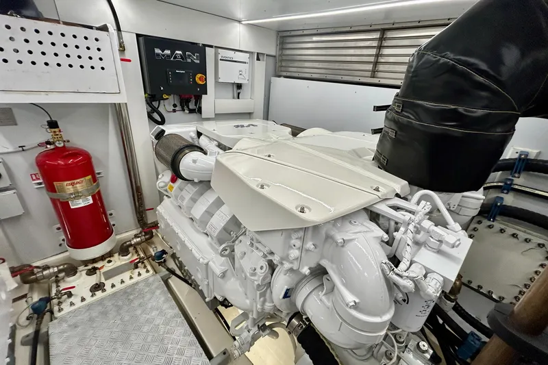 Slide: The Image of Engine room of 2024 Aicon Vivere 66 yacht featuring MAN engine and fire extinguisher system. - 123