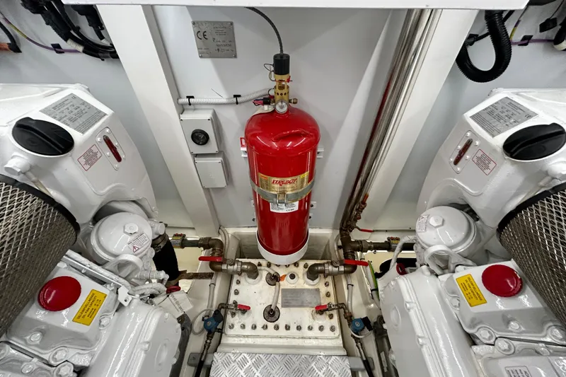 Slide: The Image of Engine room of 2024 Aicon Vivere 66 yacht with fire extinguisher and machinery. - 125