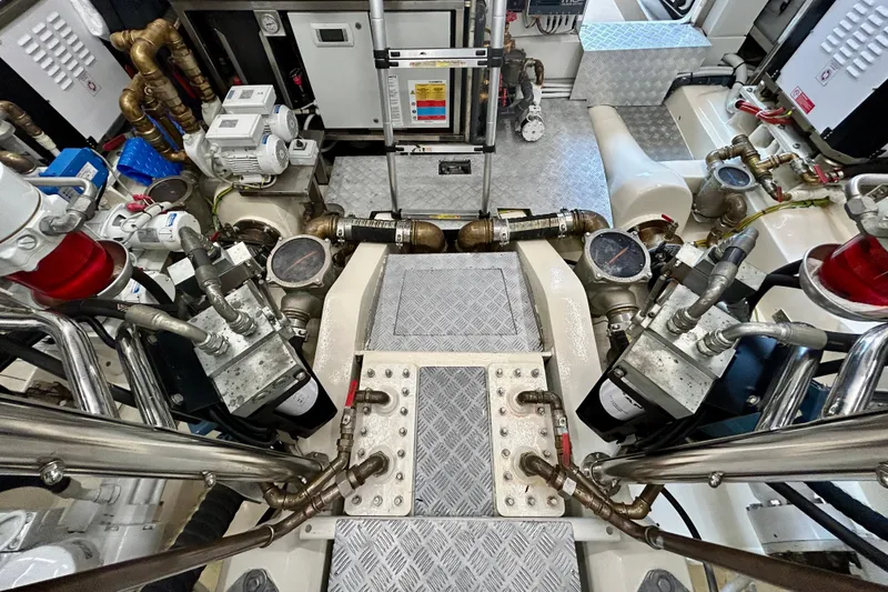 Slide: The Image of Engine room of 2024 Aicon Vivere 66 yacht, showcasing complex machinery and piping systems. - 129