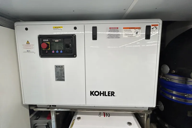 Slide: The Image of Kohler generator in Aicon Vivere 66 yacht, 2024 model, featuring control panel and safety warnings. - 131