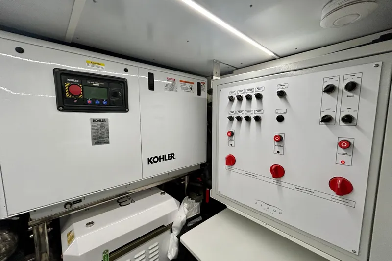 Slide: The Image of Control panel and generator in 2024 Aicon Vivere 66 yacht engine room. - 132