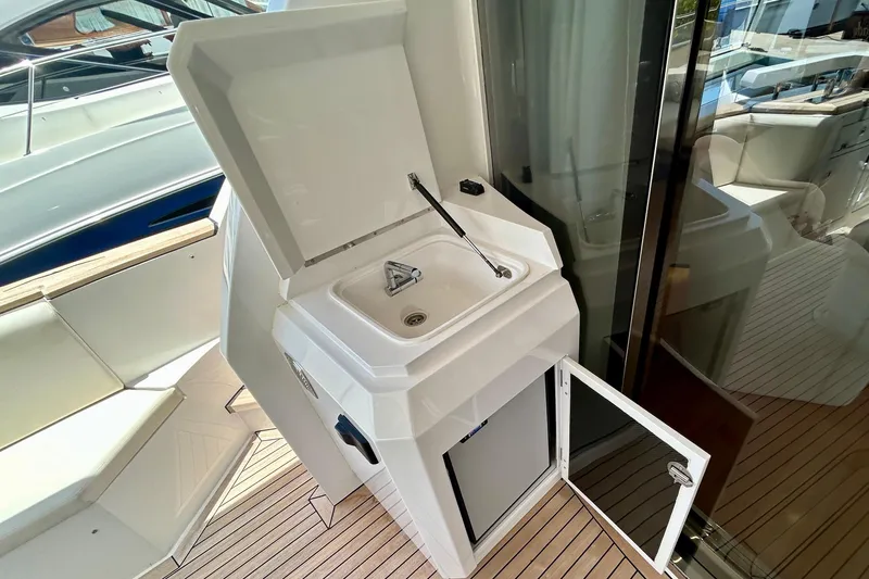 Slide: The Image of 2024 Aicon Vivere 66 yacht sink area with open storage on deck. - 17