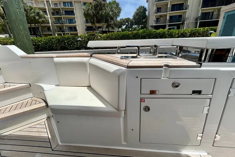 Slide: The Image of Luxurious 2024 Aicon Vivere 66 yacht deck with seating and cabinetry. - 18