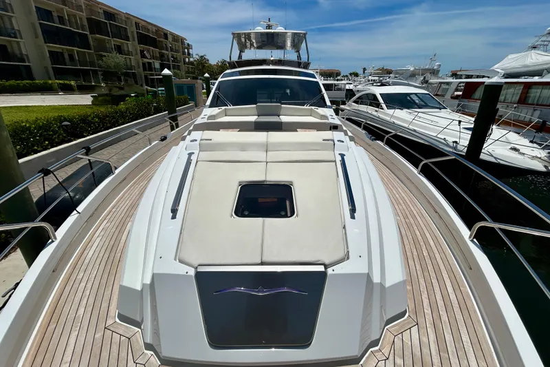 Slide: The Image of 2024 Aicon Vivere 66 yacht docked, showcasing sleek design and spacious deck. - 23