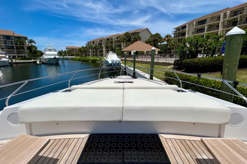 Slide: The Image of Luxurious 2024 Aicon Vivere 66 yacht docked in a scenic marina setting. - 25