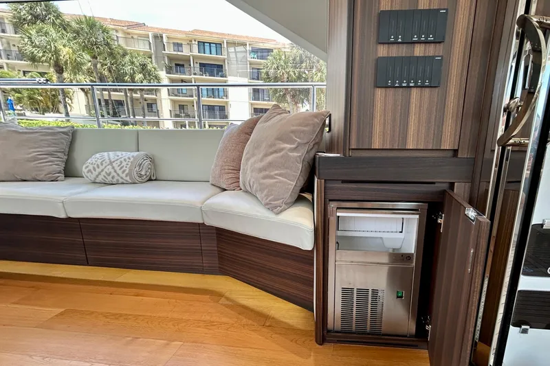 Slide: The Image of Luxurious interior of 2024 Aicon Vivere 66 yacht with plush seating and built-in amenities. - 30