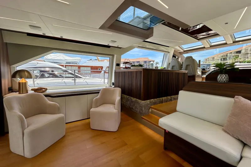 Slide: The Image of Luxurious interior of 2024 Aicon Vivere 66 yacht with elegant seating and panoramic windows. - 34