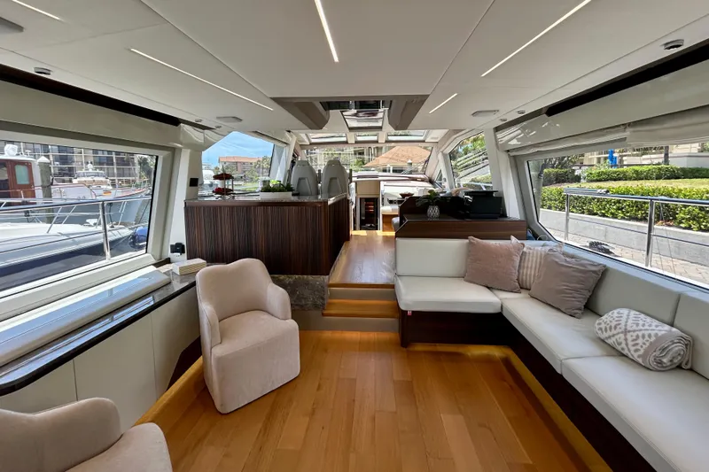 Slide: The Image of Luxurious interior of 2024 Aicon Vivere 66 yacht with modern seating and large windows. - 35