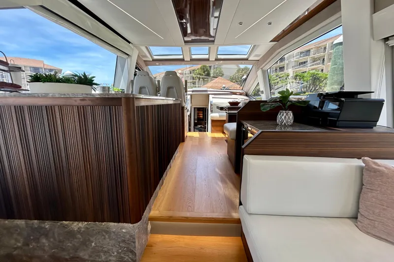 Slide: The Image of Luxurious interior of 2024 Aicon Vivere 66 yacht with modern design and wood accents. - 36