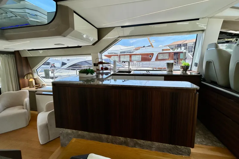 Slide: The Image of Luxurious interior of 2024 Aicon Vivere 66 yacht with modern furnishings and large windows. - 41