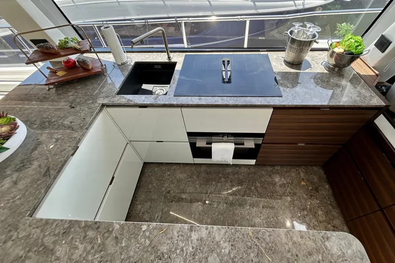 Slide: The Image of Modern kitchen interior of 2024 Aicon Vivere 66 yacht with sleek countertops and appliances. - 44