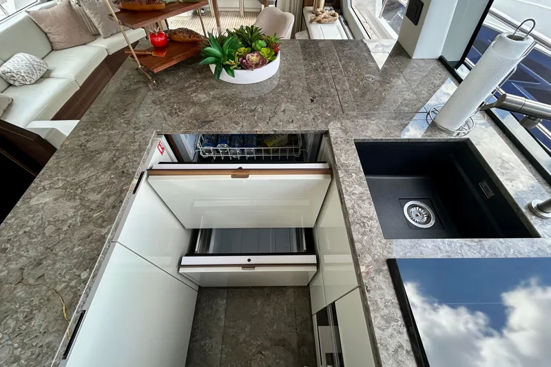 Slide: The Image of Luxurious kitchen interior of 2024 Aicon 66 Vivere yacht with marble countertops and modern appliances. - 46