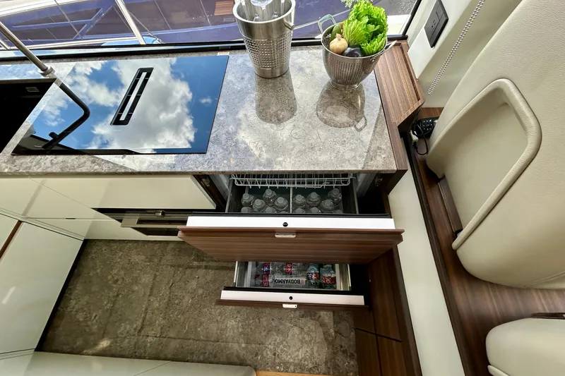 Slide: The Image of Modern kitchen interior of 2024 Aicon 66 Vivere yacht with sleek countertops and storage. - 47