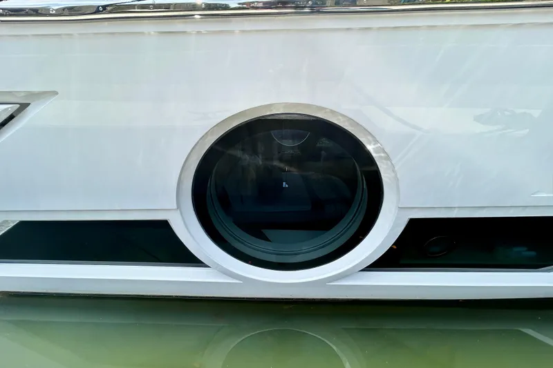 Slide: The Image of 2024 Aicon Vivere 66 yacht with sleek circular window design. - 5
