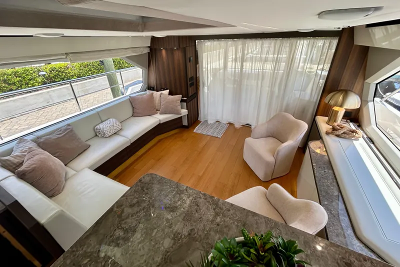 Slide: The Image of Luxurious interior of 2024 Aicon Vivere 66 yacht with elegant seating and modern decor. - 51