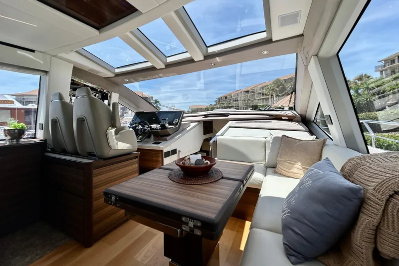 Slide: The Image of Luxurious interior of 2024 Aicon Vivere 66 yacht with panoramic windows and elegant seating. - 52