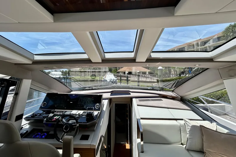 Slide: The Image of Interior view of 2024 Aicon Vivere 66 yacht, featuring modern helm and panoramic windows. - 53