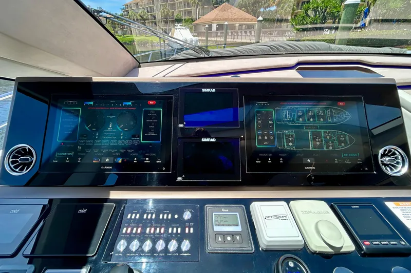 Slide: The Image of Control panel of the 2024 Aicon Vivere 66 yacht, featuring advanced navigation displays. - 56