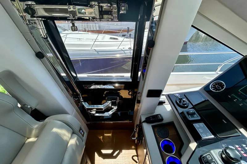 Slide: The Image of Interior view of 2024 Aicon Vivere 66 yacht cockpit with modern controls and seating. - 59