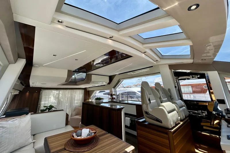 Slide: The Image of Luxurious interior of 2024 Aicon Vivere 66 yacht with modern seating and panoramic windows. - 61