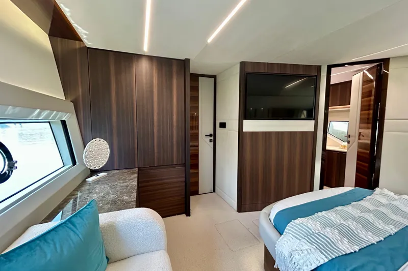 Slide: The Image of Luxurious interior of 2024 Aicon Vivere 66 yacht with modern wood paneling and elegant decor. - 68