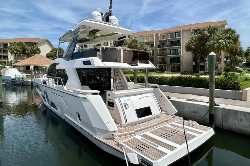 Slide: The Image of Luxury yacht Aicon Vivere 66, 2024 model, docked in a marina setting. - 7
