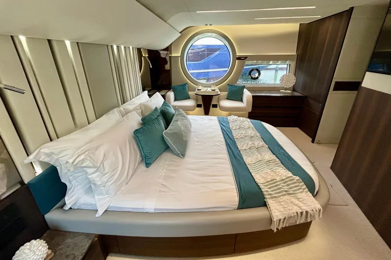 Slide: The Image of Luxurious bedroom interior of 2024 Aicon Vivere 66 yacht with elegant decor and round window. - 70