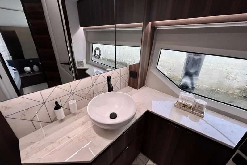 Slide: The Image of Luxurious bathroom interior of 2024 Aicon Vivere 66 yacht with modern sink and elegant design. - 72