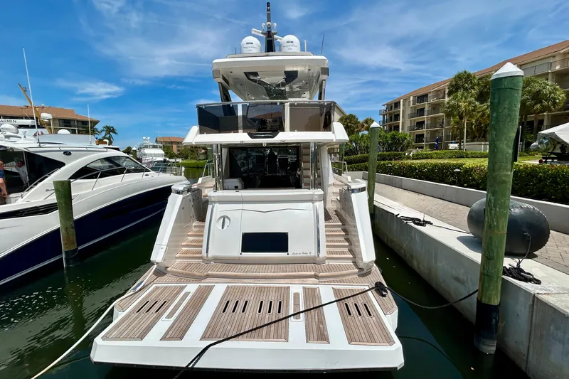 Slide: The Image of Luxury yacht Aicon Vivere 66, 2024 model, docked at marina under clear blue sky. - 8