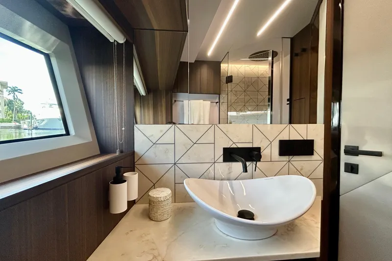 Slide: The Image of Luxurious bathroom interior of 2024 Aicon Vivere 66 yacht with modern sink and elegant design. - 82