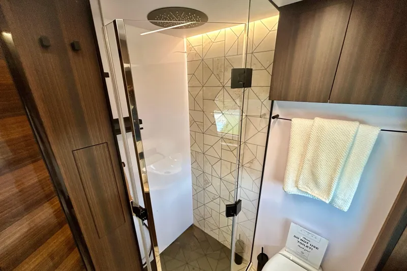 Slide: The Image of Luxurious bathroom in 2024 Aicon Vivere 66 yacht with modern shower and elegant wood finishes. - 83