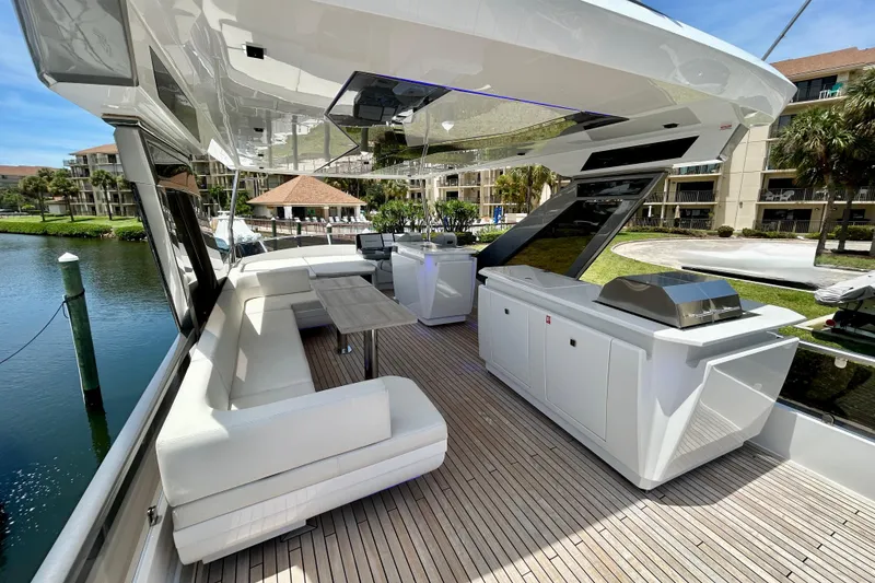 Slide: The Image of Luxurious 2024 Aicon Vivere 66 yacht deck with seating and outdoor kitchen. - 91