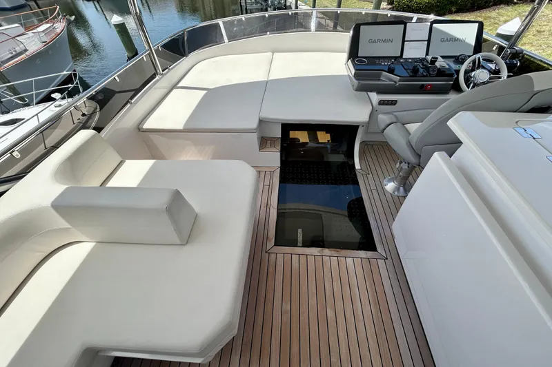 Slide: The Image of Luxurious 2024 Aicon Vivere 66 yacht deck with plush seating and advanced navigation systems. - 97