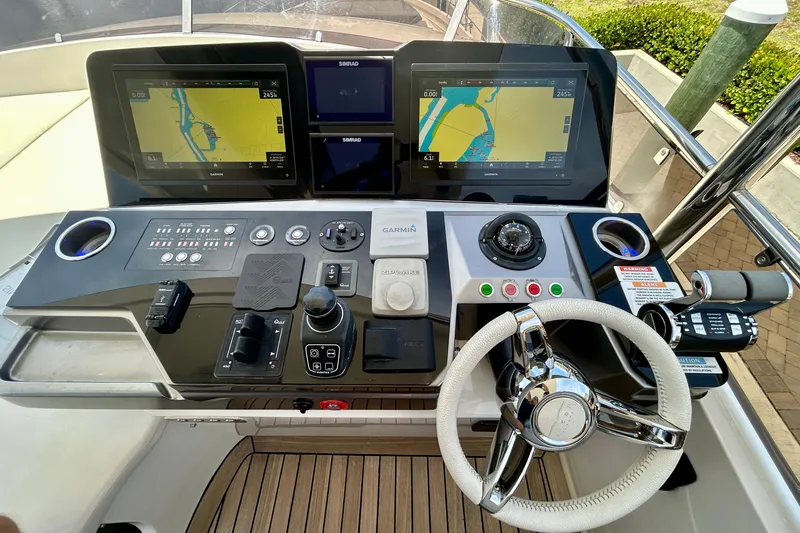 Slide: The Image of Helm of 2024 Aicon Vivere 66 yacht with navigation screens and controls. - 99