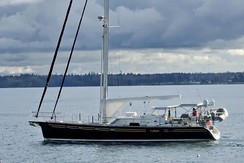 The Image of Sailing yacht Waterline 50, 2006 model, cruising on a calm sea under cloudy skies. - 0